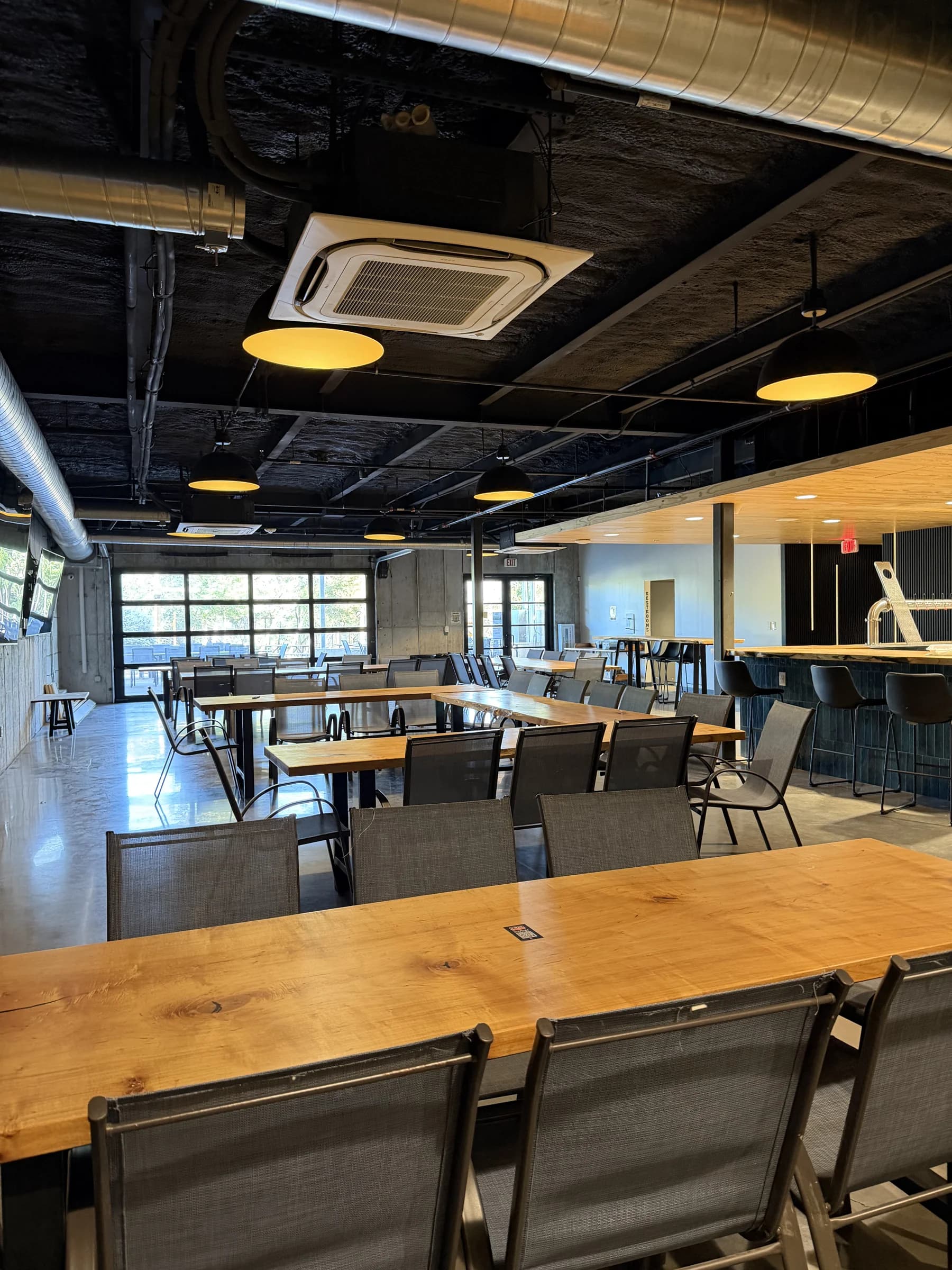 A first look downstairs at Fast Friends: warm wood, concrete and dark ceilings in Gary Club’s future Austin home